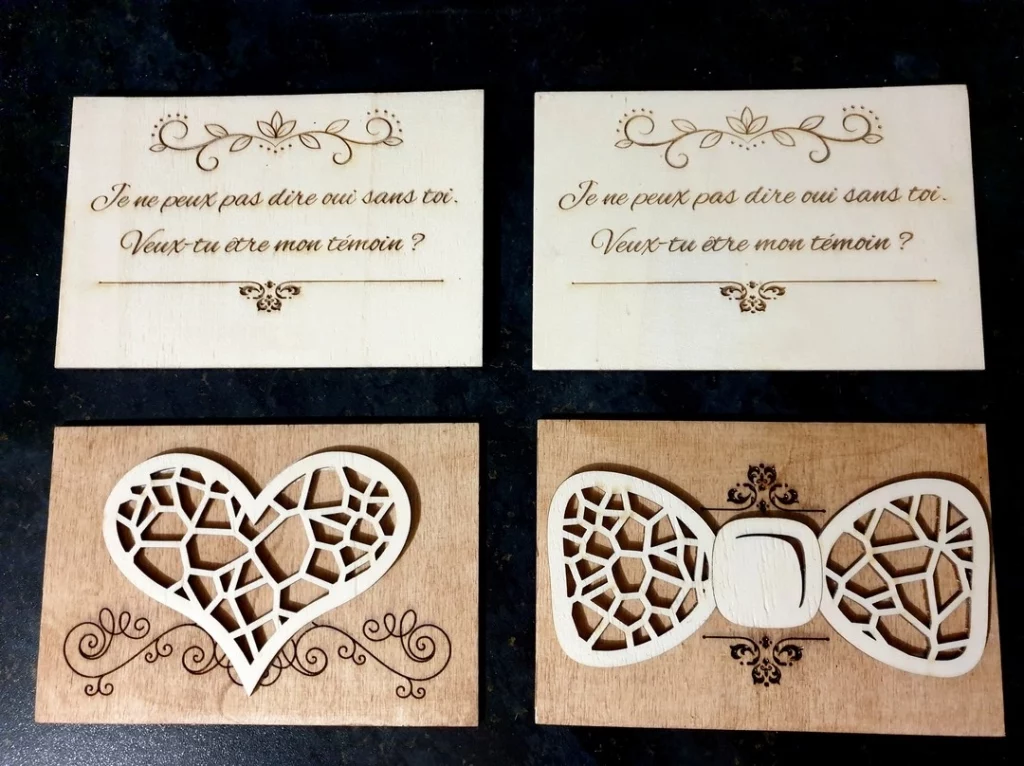 Réalisation de cartes en bois pour demande de témoin. Les cartes "femmes" ont un coeur, celles pour les hommes ont un noeud papillon.